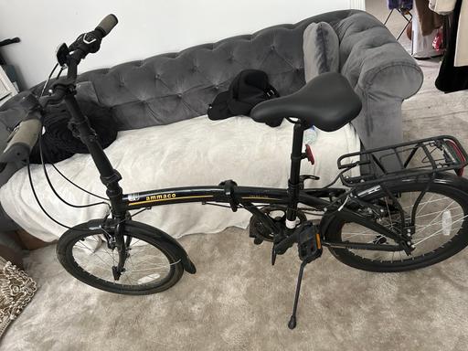  — Folding bike, one flat tyre and has rust