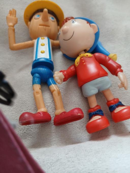  — 2 figures pinocio and noddy