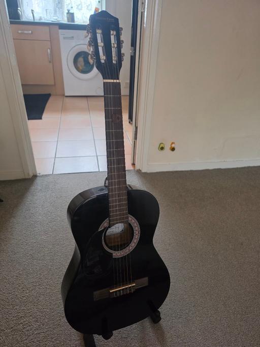  — guitar with stand and pick