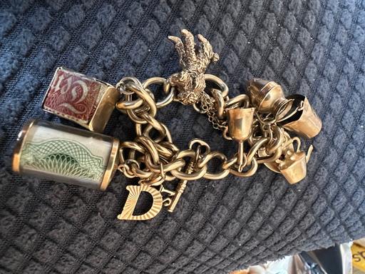  — 9CT 375 Gold charm Bracelet Multiple charms