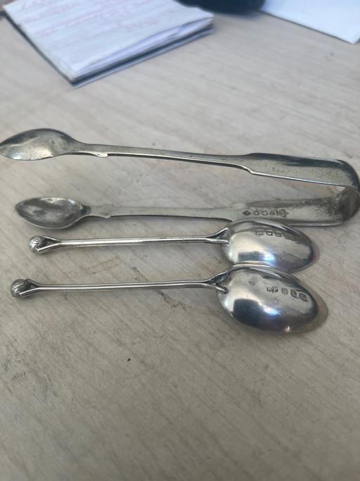 — Sugar tongs and two teaspoons silver