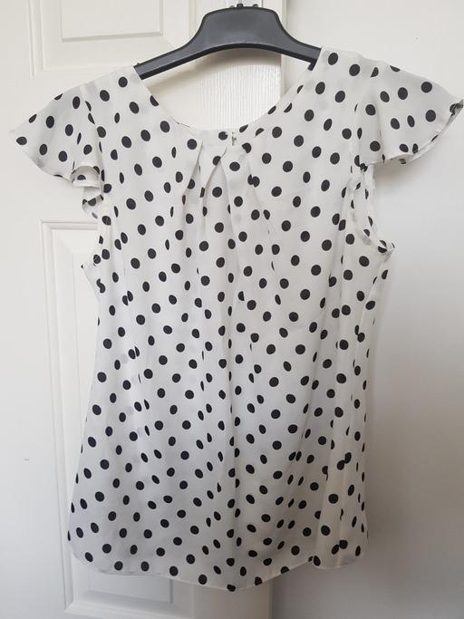  — White and black spotty top
