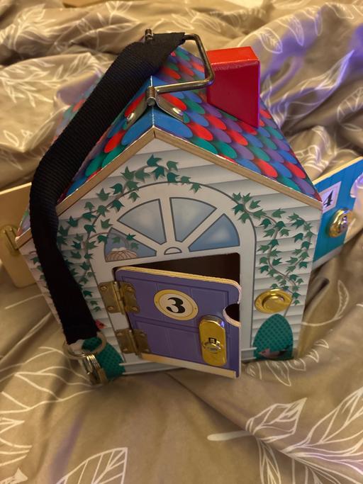  — Melissa and Doug wooden doorbell house
