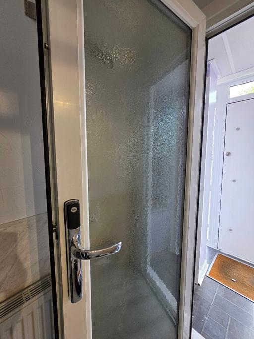  — White frosted glass door with key fob entry