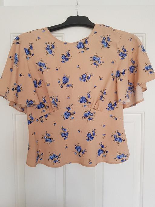  — Peach floral top