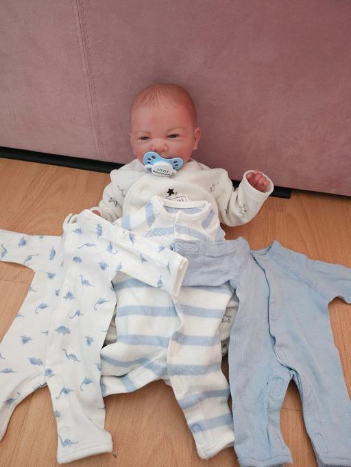  — Reborn baby doll & clothes bundle