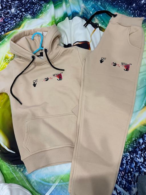  — Tracksuit