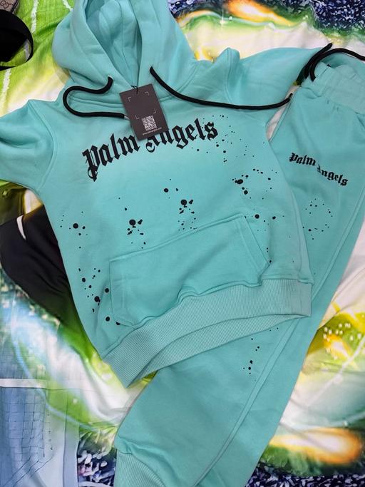  — Tracksuit