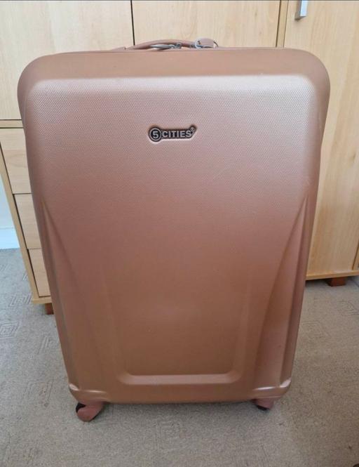  — Rose gold hard shell 4 wheel medium suitcase