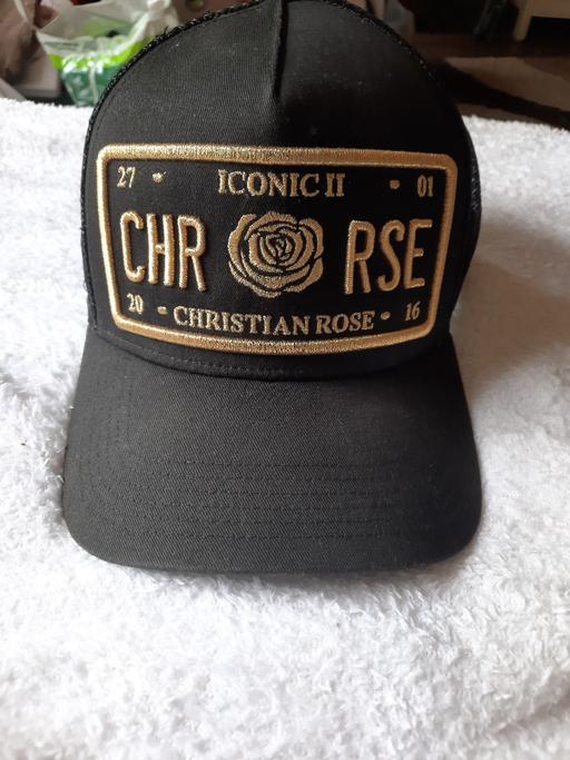  — christian rose cap