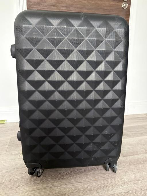  — Suitcase
