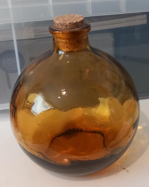  — Heavy amber glass bottle vase