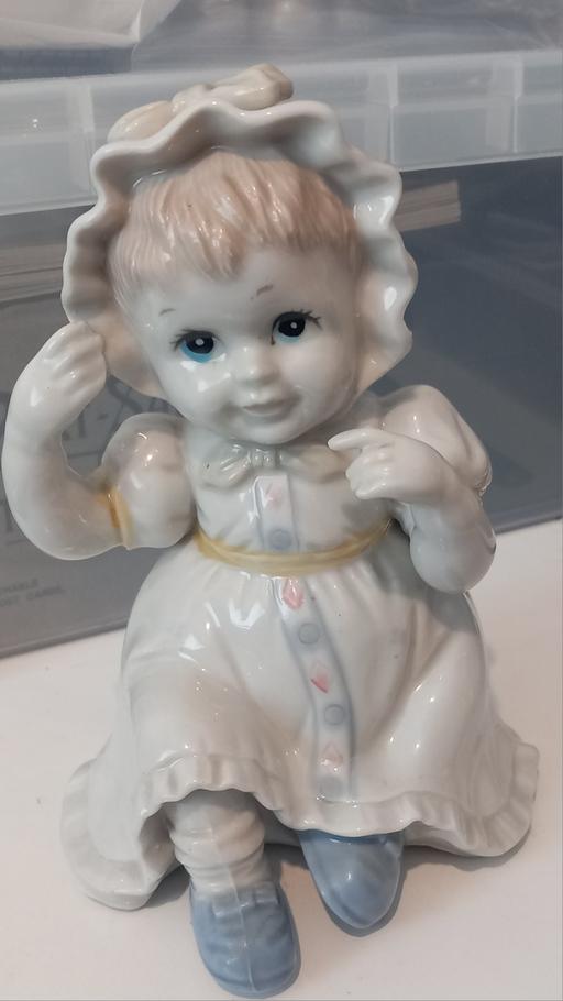  — Vintage porcelain piano baby figurine