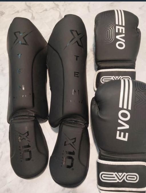  — boxing gloves and shin guards