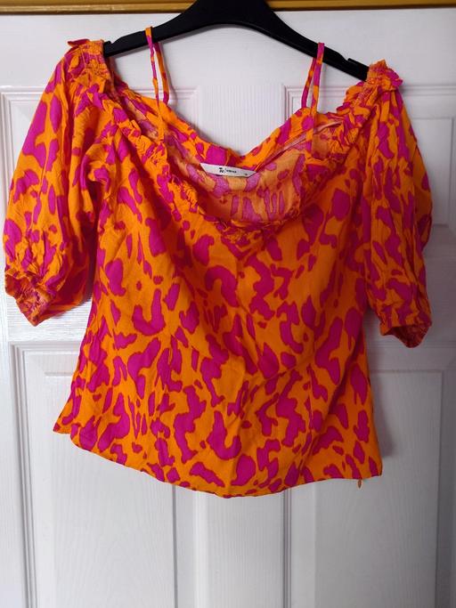 — Women's orange/pink top size 16