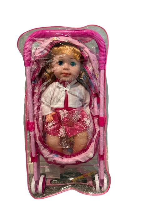  — Baby doll with pink stroller set