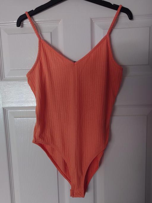  — Women's peach bodysuit size 12-14