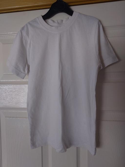  — Boys plain white top size 6-7 years