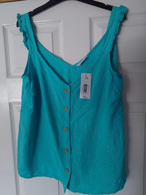 — Women's turquoise sleeveless top size 14