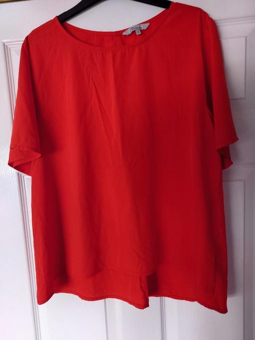  — Women's orange top size 14