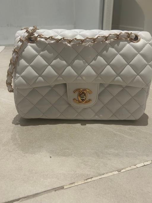  — White Chanel clutch bag