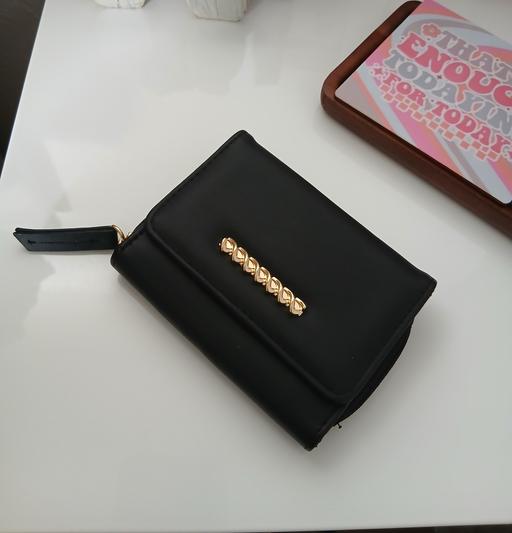  — Purse Used Once