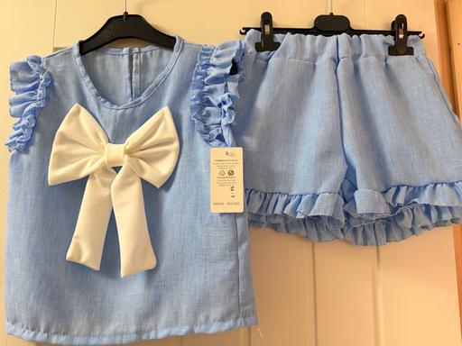  — Girls blue bow top and shorts set