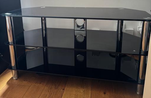  — TV stand. Glass. Black. Durable. To go ASAP