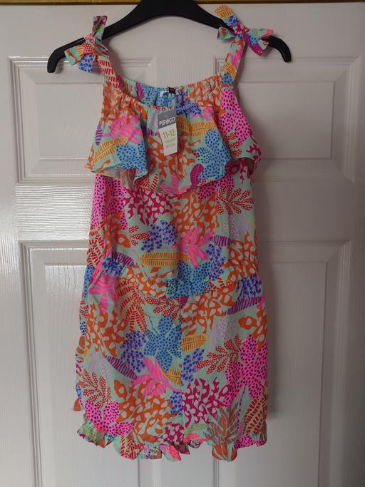  — Girls floral playsuit size 11-12 years