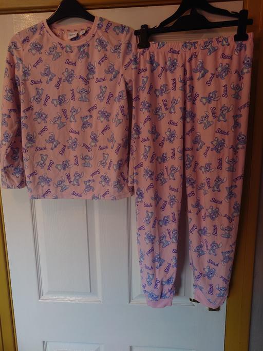  — Girls pink stitch pyjamas size 10/11 years