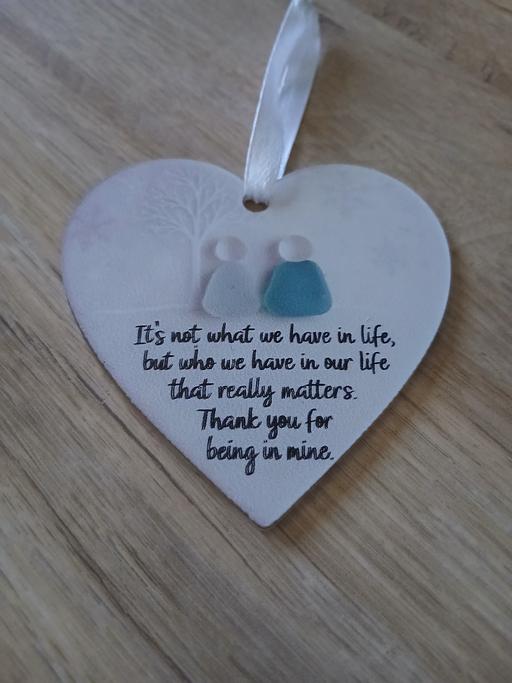  — Plaque New