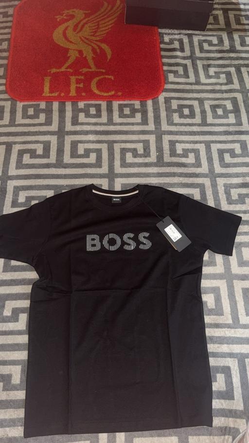  — Boss tops