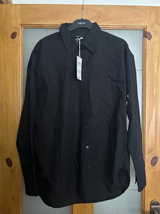  — Next Black Shirt