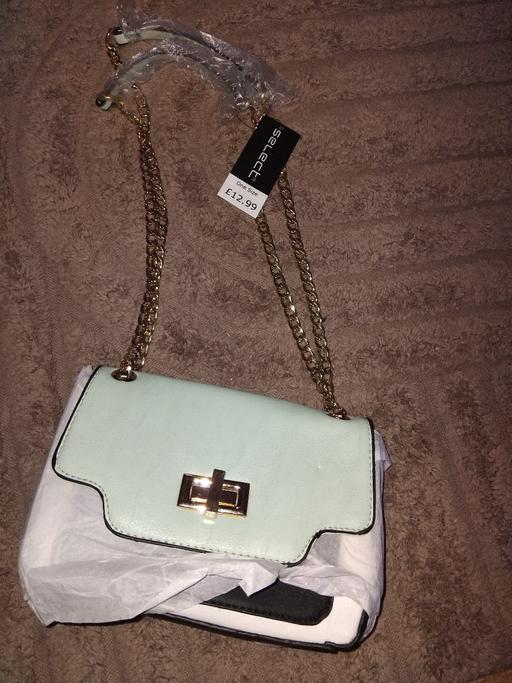 — brand new handbag