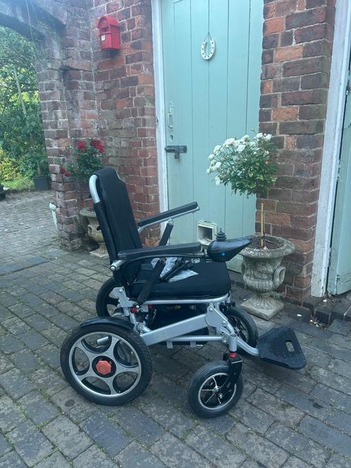  — Electric wheelchair folds flat