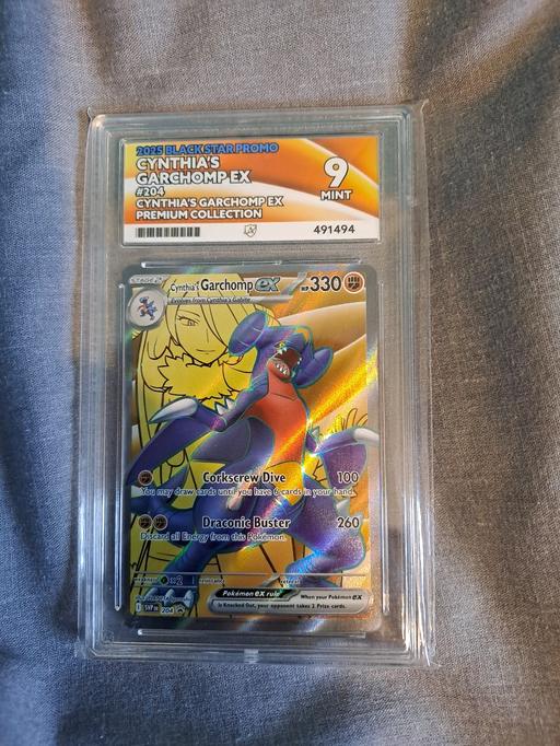  — cynthias garchomp ex 2025 black star promo