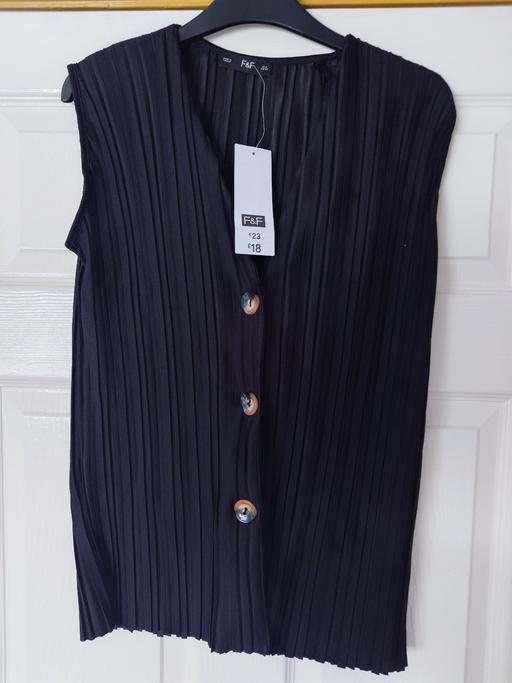  — Women's black sleeveless top size 8