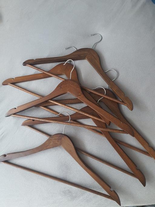  — 45 or more brown wooden hangers