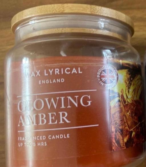  — Glowing amber scented candle