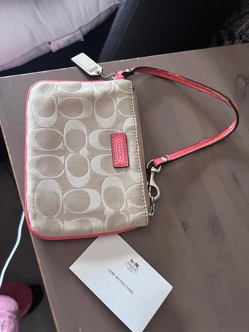  — Coach wristlet