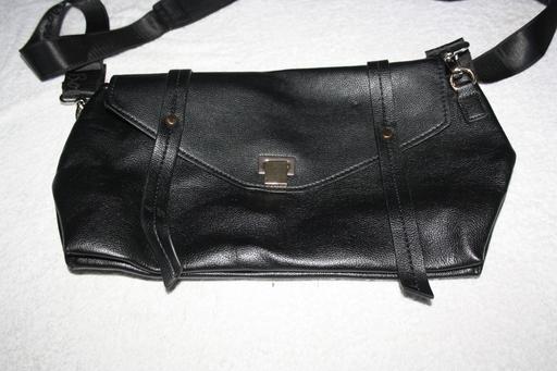  — black leather handbag