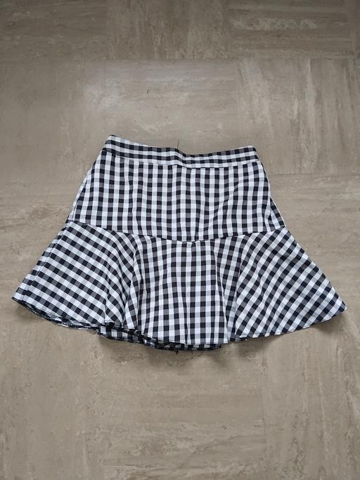  — Skort 12.