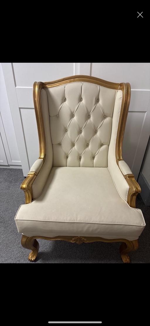  — White and gold leather chair
