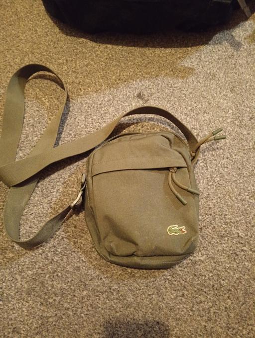  — green Lacoste man bag