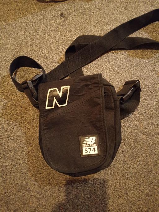 — black new balance man bag