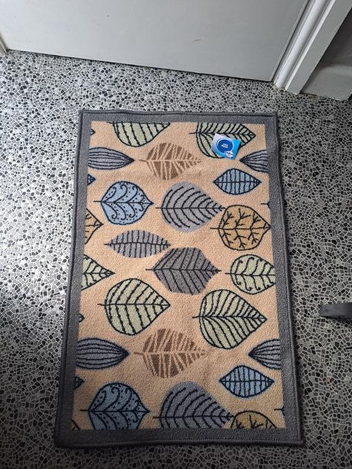  — new door mat with tags