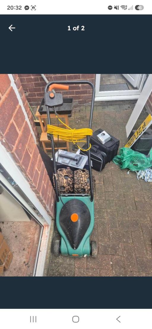  — Challenge brand corded electric lawnmower.