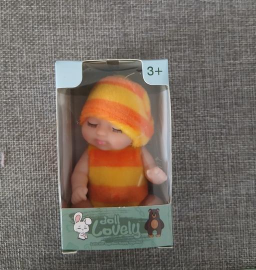  — Small Doll New