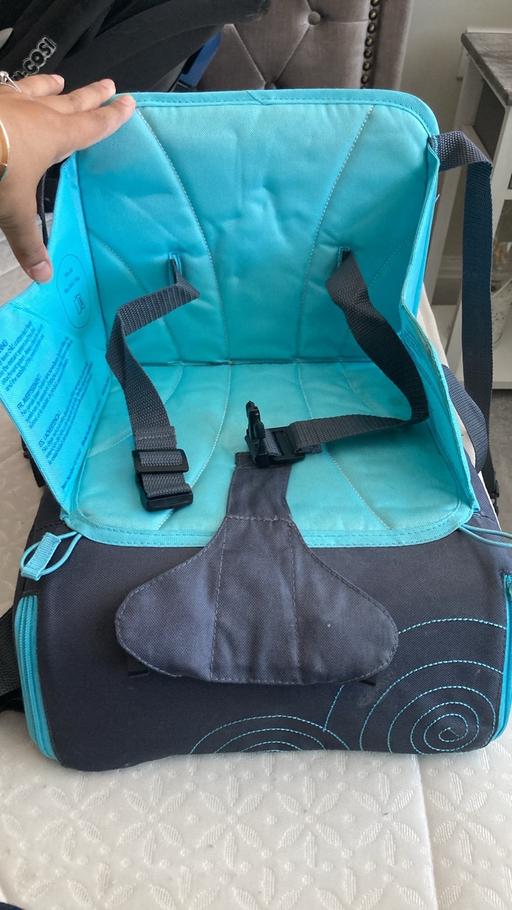  — Travel seat