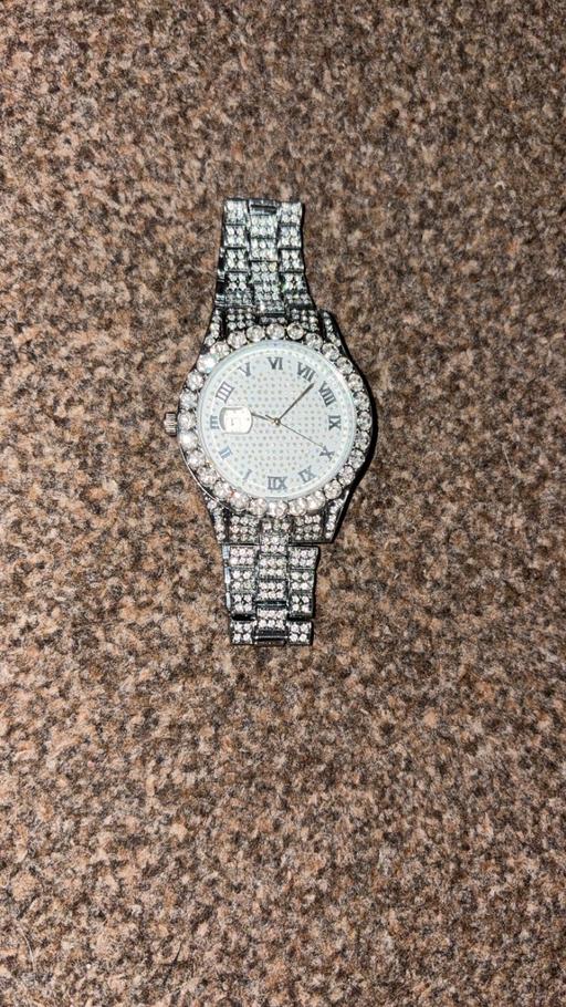  — Silver watch